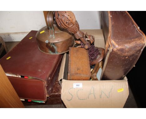 A box of various sundry items to include leather satchel; wooden table lamp; copper kettle; suitcases and contents 