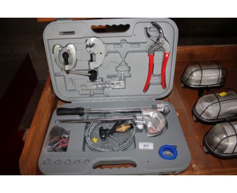 A cased set of plumbing tools