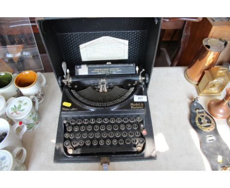 A Remington model 5 portable typewriter and carrying case