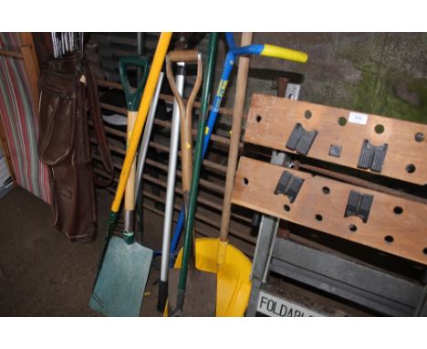 A quantity of long handled garden tools