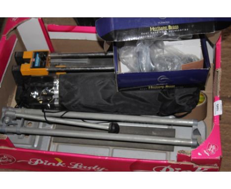 A box containing two tile cutters; as new camera tripod; door handles etc. 