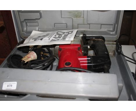 A Power Devil rotary hammer drill in case