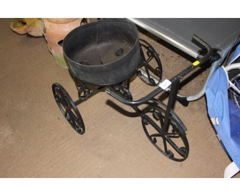 A garden planter in the form of a tricycle 
