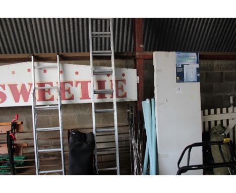 An extending aluminium ladder 