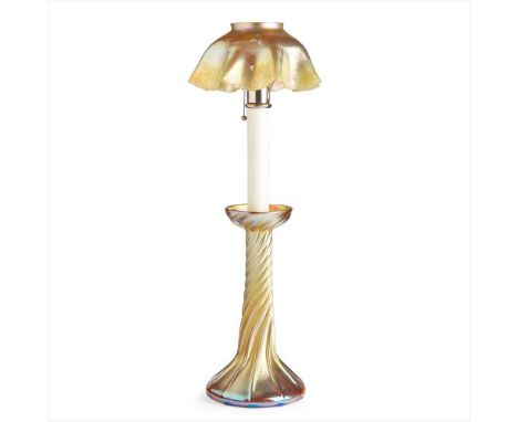 TIFFANY STUDIOS, NEW YORK IRIDESCENT 'FAVRILE' GLASS CANDLE LAMP &amp; SHADE, CIRCA 1910 the lamp of tapering form with raise