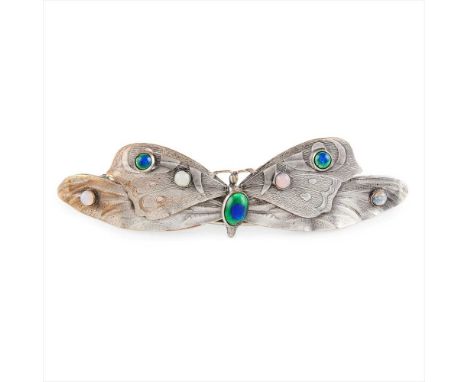 E. THOMPSON  GLASGOW SCHOOL WHITE METAL BUTTERFLY HAIRCOMB, CIRCA 1910 cast as a butterfly with textured outstretched wings, 