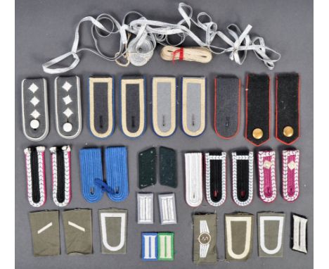 A collection of assorted post-WWII Second World War German / East German uniform epaulettes, insignia and other accessories. 