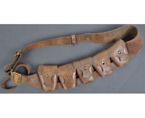 An original 1915 dated WWI First World War British Army ammunition leather bandolier. The bandolier of typical form, with x5 