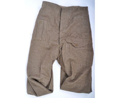 A pair of WWII Second World War British Army issue battledress uniform trousers. 1940 pattern, and dated 1944 (slightly illeg