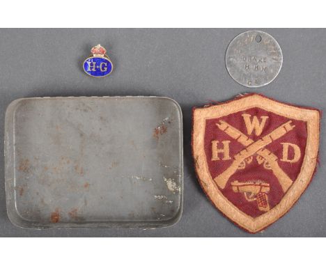 A collection of WWII Second World War and other period Home Guard related items, to include; an original ' HG ' enamel lapel 
