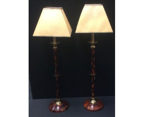 Lighting - a pair of tall brass and lacquered side lights, 74cm high;  a turned oak lamp base, (3) 