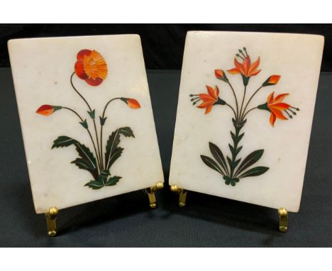 A pair of  Grand Tour type Pietra Dura marble panels, inlaid with stylised flower stems, 13cm x 10cm, gilt metal easel stands