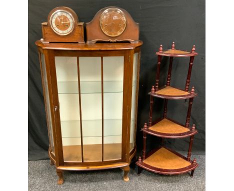 A walnut serpentine single door display cabinet,  109cm high, 76cm wide; a reproduction four tier graduated whatnot, 107cm hi