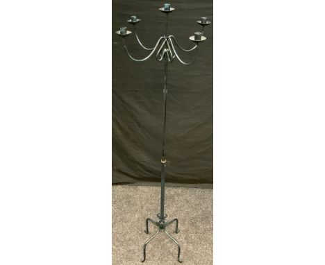 A floor standing cast iron five light candlestick. 