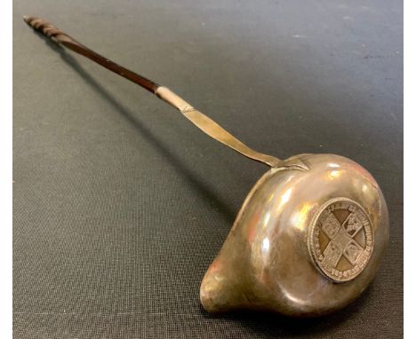 A George III silver toddy ladle, inset with coin, whale bone handle, 35cm long, c.1760 