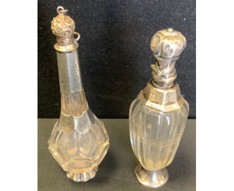 A 19th century silver mounted and glass scent flask, the cover embossed with foliate scrolls, 11.5cm high, c.1860;  another (