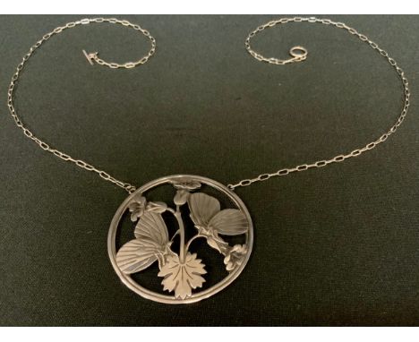 Arno Malinowski for Georg Jensen, a silver pendant necklace, open cast circular panel with two butterflies standing upon flow