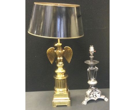 A gilt metal side light, the column with eagle, 54cm high;  another, silver plated, 34cm high (2) 