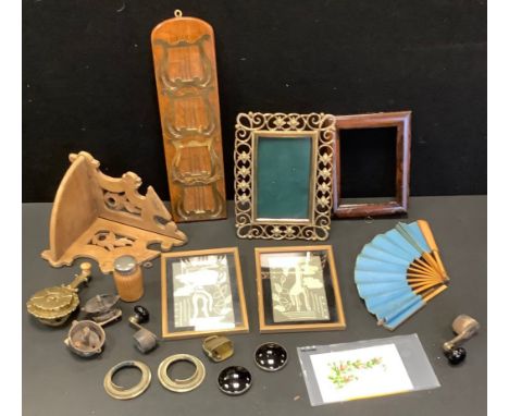 A wall handing oak letter rack, with four brass lyre shaped sections, 37cm high;  a brass easel photograph frame;  a 19th cen