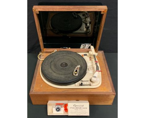 A 1950s/60s Garrards 4HF (H) record player turntable, original rubber platform, interchangeable stylus heads, wooden tinted t