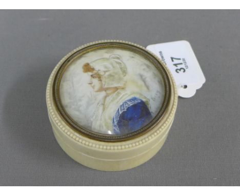 19th century ivory circular box, the cover containing a portrait miniature of a lady, signed indistinctly, 7.5cm diameter 