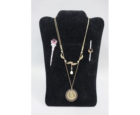 Mixed lot to include a Queen Victoria 1887 shilling coin pendant on a yellow metal chain, gilt metal necklace, silver brooch 