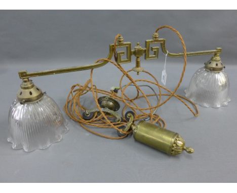 Brass rise and fall light  fitting with a pair of ribbed glass shades, 