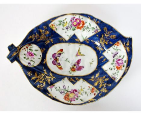 An 18th century Worcester leaf shaped dish, the blue-scale ground painted with panels of flowers and butterflies, unmarked, 2