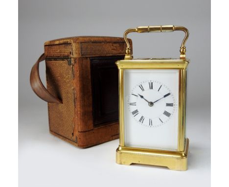 A late 19th century French carriage clock, the 2½ inch white enamel dial with ring of Roman numerals, the movement striking o