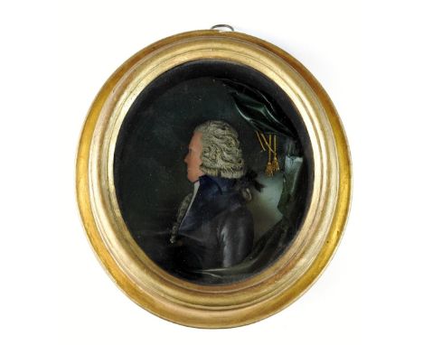 A George III wax portrait relief bust of a gentleman, polychrome decorated, the giltwood oval frame inscribed verso 'Percy.Ju