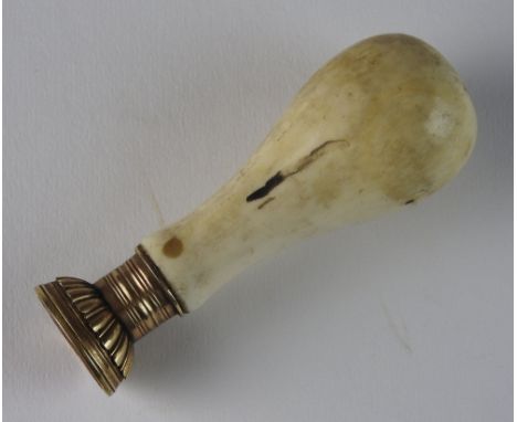 A 19th century bone handled desk seal, with armorial carved carnelian seal, 8.5cm high

Note: Provenance: Linley Hall, Shrops