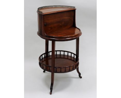 A late 19th / early 20th century mahogany revolving table cocktail cabinet, the demi lune quarter galleried top over a revolv