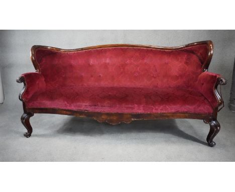 A late 19th century stained birch framed sofa in cut floral upholstery on cabriole supports. H.105 W.207 D.60 