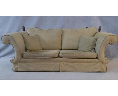 A Knole style fixed arm two seater sofa with extra fabric. H.93.5 L.229 D.97cm. 