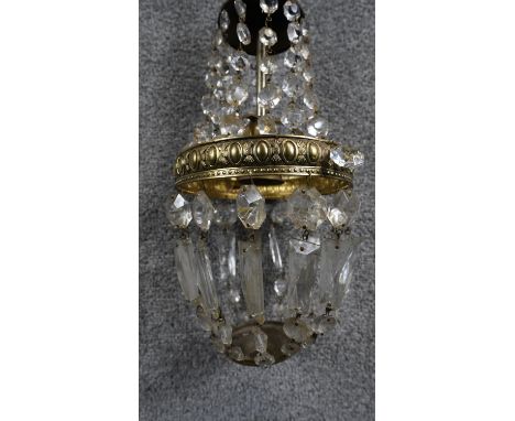 A cut crystal and brass chandelier. With a brass chain fitting.  D.15cm 
