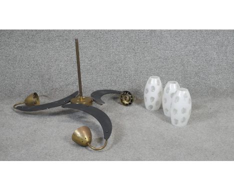 A vintage ceiling chandelier with triple shaped arms and opaque ovoid glass shades. D.60cm 