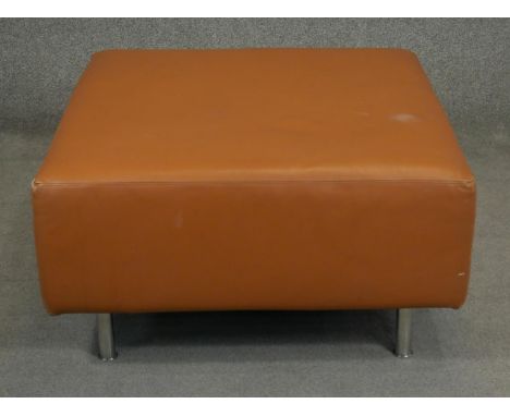 A contemporary Hay 'Mags' footstool upholstered in light tan leather. H.44 W.92 D.80cm 