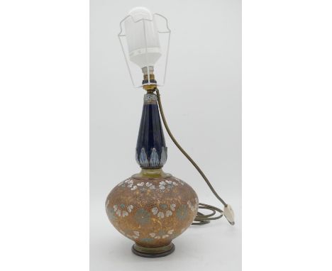 A Royal Doulton stoneware baluster table lamp with gilded detailing and floral design. Stamped and numbered to base. H.60cm 