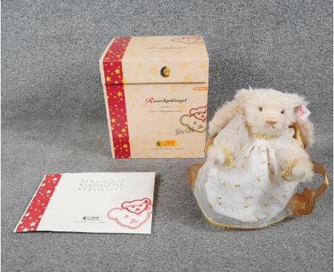 A boxed limited edition Steiff Rauschgoldengel angel teddy bear with certificate and Steiff button in left ear. H.23 W.23cm 