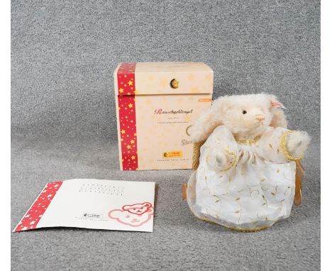 A boxed limited edition Steiff Rauschgoldengel angel teddy bear with certificate and Steiff button in left ear. H.23 W.23cm 