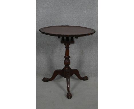 A Georgian style mahogany occasional table with piecrust tilt top and birdcage action on carved tripod cabriole supports. H.6