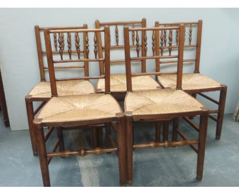 Five late 19th century country chairs, bobbin turned back rail, rush seats, turned front stretcher (later added extenders to 