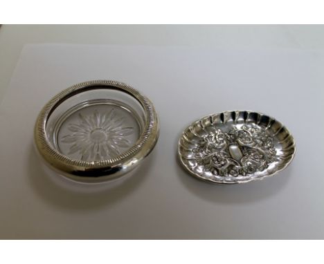 Silver oval embossed pin tray and a silver mounted glass trinket tray.