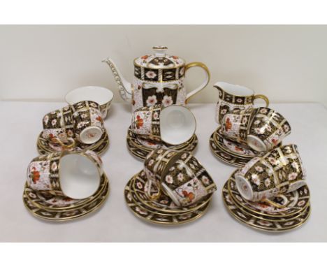 Royal Crown Derby Imari pattern tea set pattern no 2451, comprising twelve trios, sugar bowl, milk jug and teapot.   Conditio