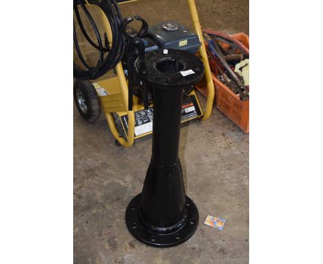 An iron blacksmiths tool stand formed from the base of a vintage street lamp