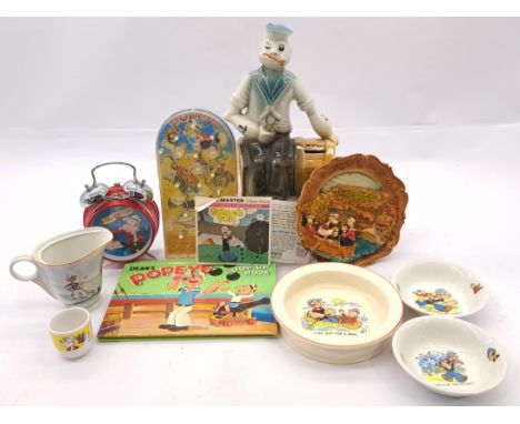 Popeyes Collectibles group including: Popeye Ceramic bank ornament, Dean's Popeye Pop-Up Book, Zeon 1989 Alarm Clock, Royal E