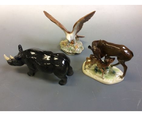 Lot to include three animal figurines: a Melba Ware rhino, a bird of prey and a deer and fawn.