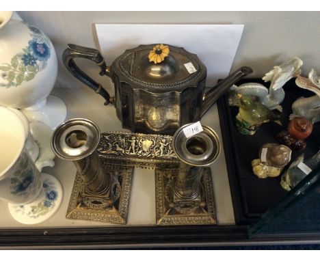 A silver cherub decorated Goldsmith box, two Elkington plate candlesticks, and one plate teapot.