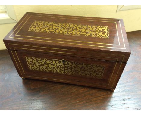 A rosewood with brass inlay tea caddy.