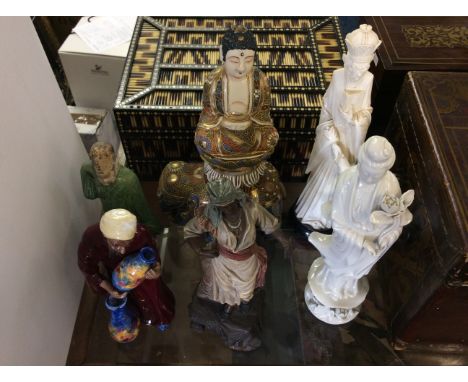 Lot to include a selection of china and ceramic oriental figurines including Buddha, Confucius, pot sellers and dancers.